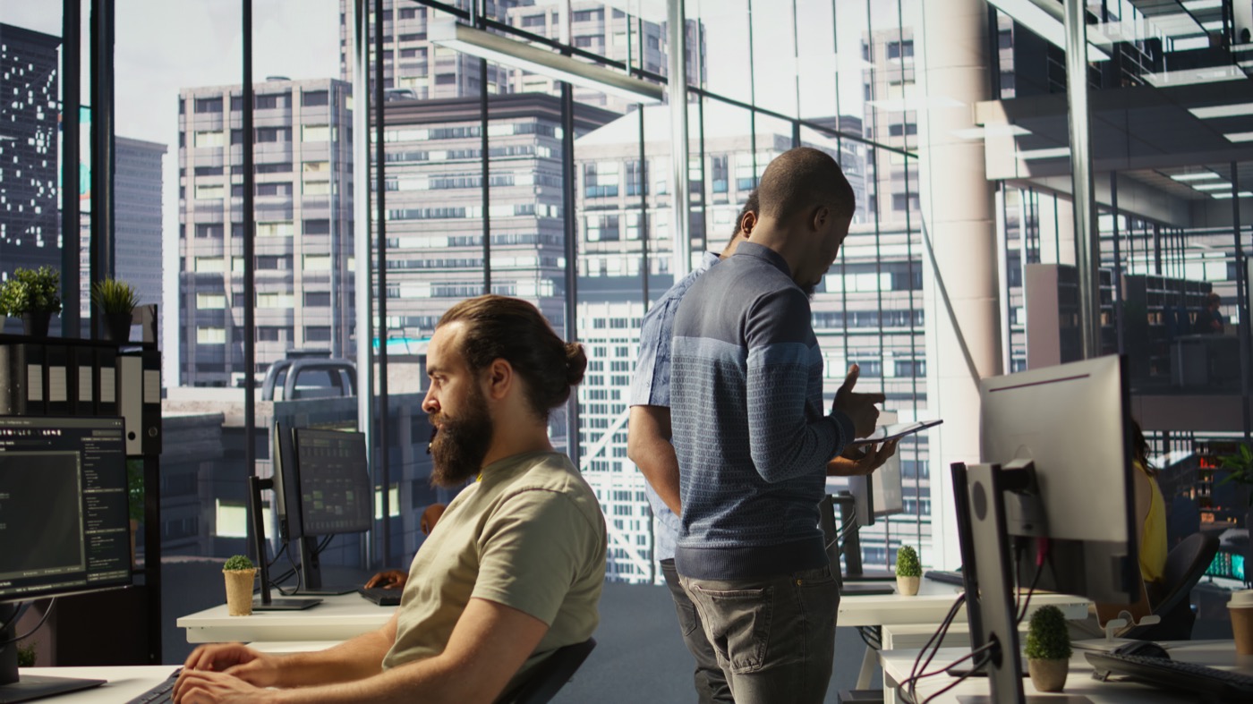 Managers evaluating work in a modern office
