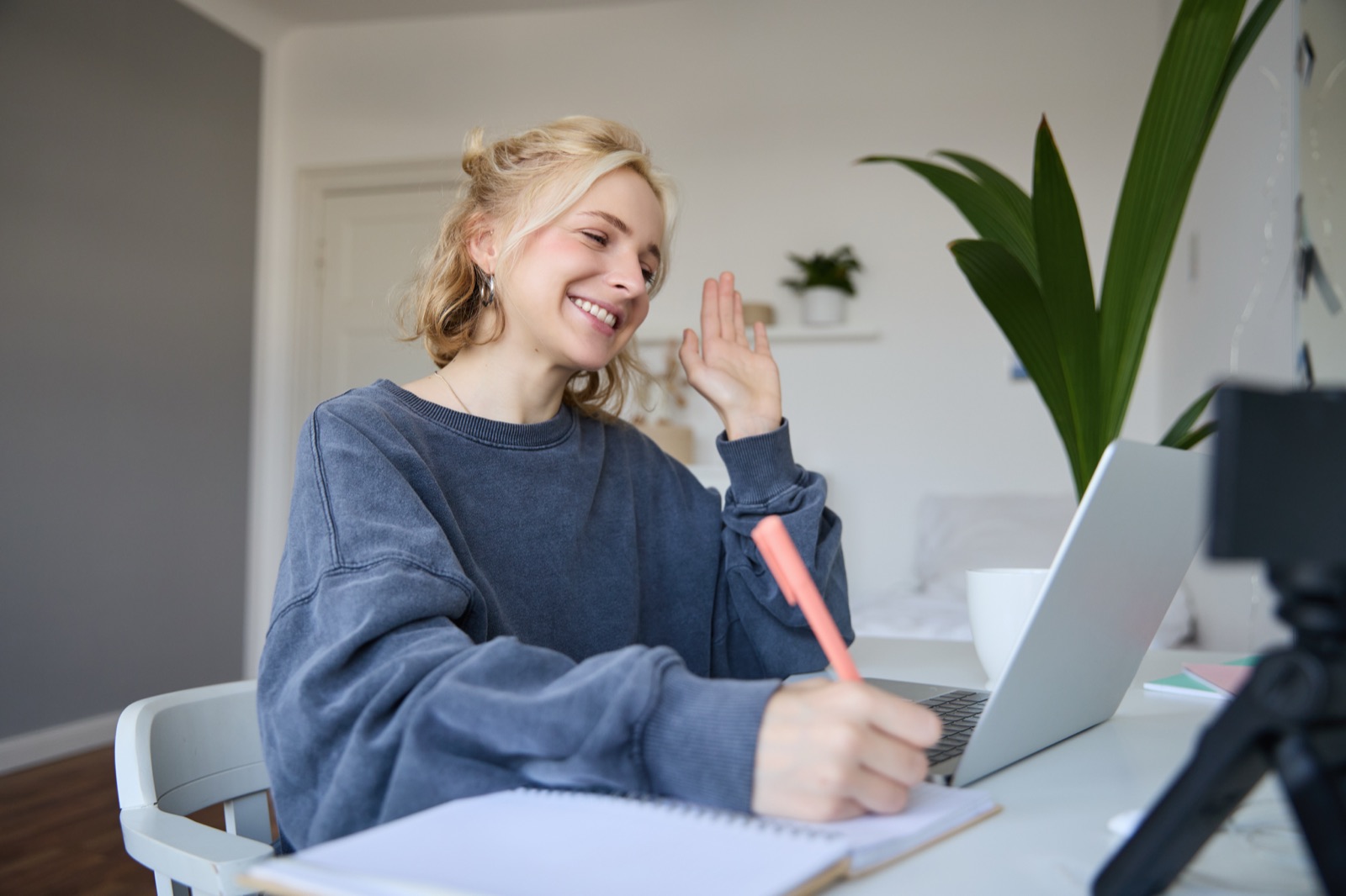 MoleculeData team member smiling at laptop